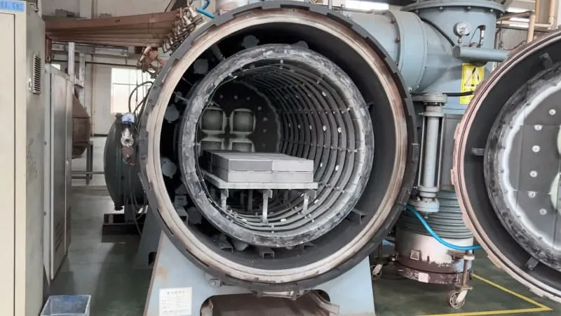 Green compact of neodymium magnet, displaying the pressed and shaped raw material before the sintering process.